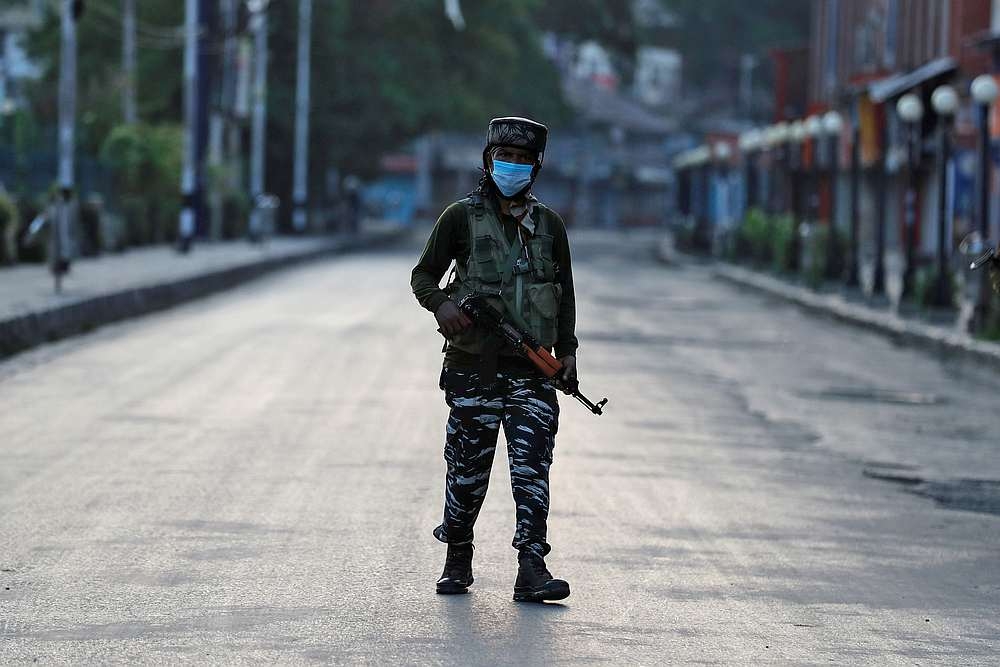 File photo of an Indian Central Reserve Police Force officer patrolling on an empty street during a lockdown on the first anniversary of the revocation of Kashmir's autonomy, in Srinagar August 5, 2020. Soldiers in India-administered Kashmir carried out a large-scale manhunt today, the government said, a day after nine Hindu pilgrims were killed in one of the deadliest recent attacks on civilians. — Reuters pic