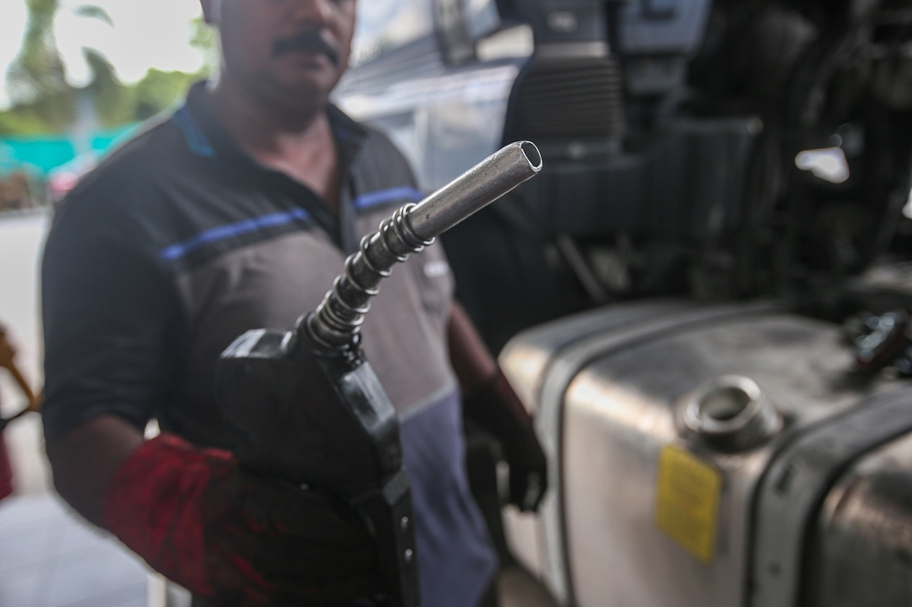 A vehicle owner refuels diesel at a gas station in Khantan Perak on June 10, 2024. — Picture by Farhan Najib