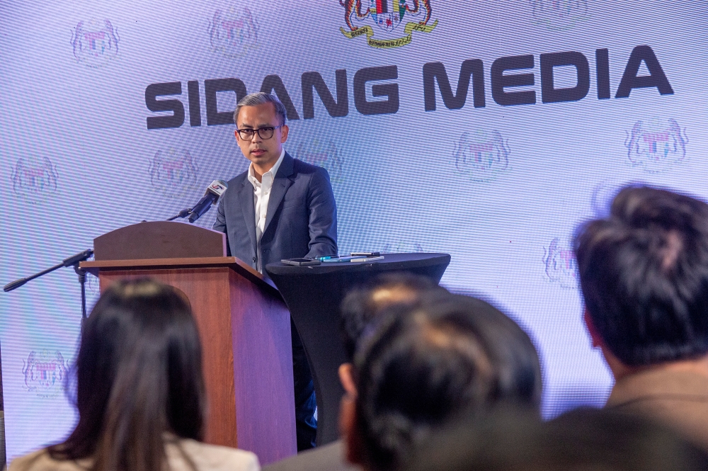 Communications Minister Fahmi Fadzil speaks during the announcement ceremony of the theme and logo for National Day and Malaysia Day (HKHM) 2024 and holds a weekly press conference in Putrajaya on 5 June 2024. Picture by Shafwan Zaidon