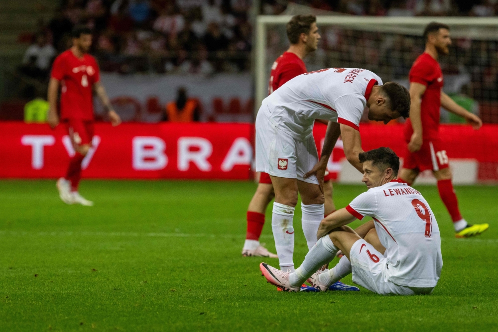 Poland’s forward #09 Robert Lewandowski (Bottom) reacts on the pitch during the international friendly football match between Poland and Turkiye in Warsaw, Poland June 10, 2024. — Reuters pic