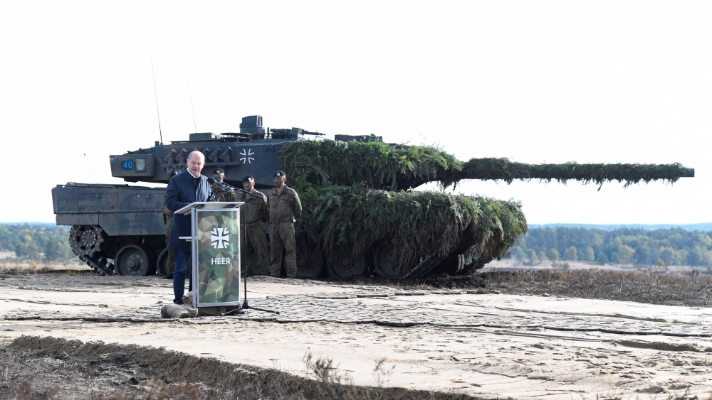 German Chancellor Olaf Scholz delivers a speech in front of a Leopard 2 tank during a visit to a military base of the German army Bundeswehr in Bergen in this file photo taken on October 17, 2022. Norway, which has ordered 54 German-made Leopard 2 tanks, will assemble 37 of them on Norwegian soil and potentially assemble tanks for other countries. — Reuters pic  