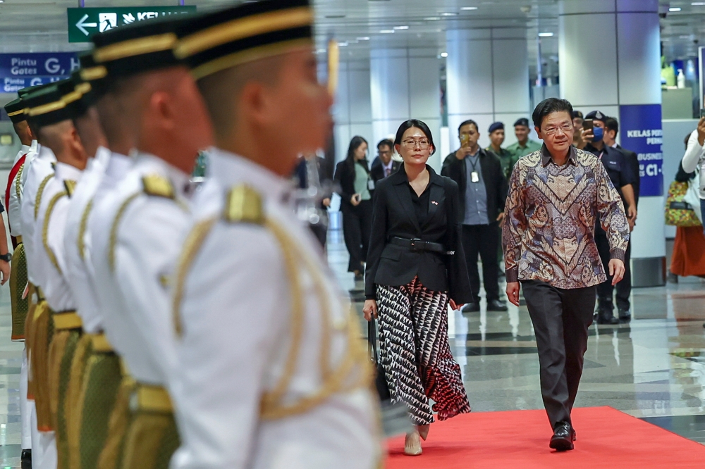 Singapore Prime Minister Lawrence Wong arrives with his wife Loo Tze Lui at the Kuala Lumpur International Airport (KLIA) Terminal 1 on June 11, 2024 for his two-day visit to Malaysia. — Bernama pic 