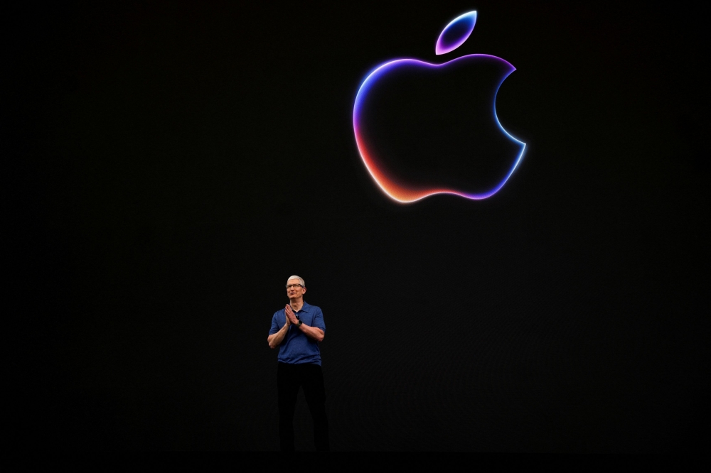 Apple CEO Tim Cook attends the annual developer conference event at the company's headquarters in Cupertino, California June 10, 2024. — Reuters pic