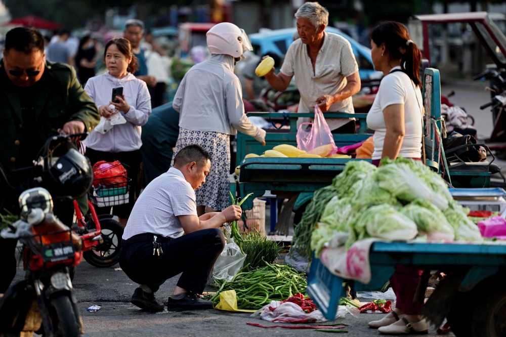 The consumer price index rose 0.3 per cent on-year in May, unchanged from the increase recorded in April and the fourth straight month in positive territory, according to the National Bureau of Statistics. — AFP pic