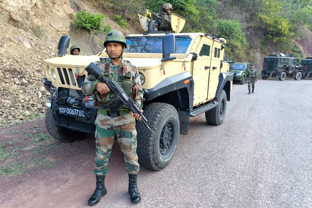 Indian army personnel look on during a search operation in Reasi on June 10, 2024, after gunmen in Kashmir ambushed the bus packed with Hindu pilgrims. — AFP pic