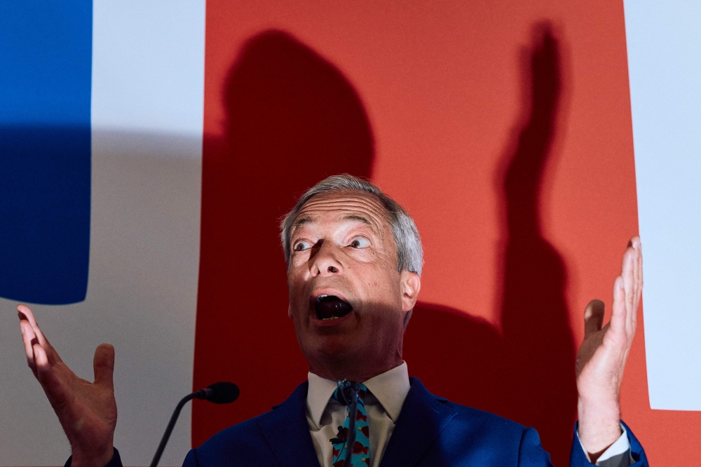 A 28-year-old man has been charged with using threatening behaviour after Brexit talisman Nigel Farage was pelted with projectiles while campaigning for the UK general election, police said today. — AFP pic