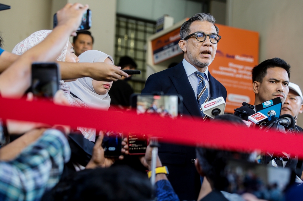 Lawyer, Fahmi Abd Moin (centre) representing the father of Zayn Rayyan Abdul Matiiin speaks to the media at the Petaling Jaya Court Complex, June 12, 2024. He said today that the investigation into the murder of autistic boy, Zayn Rayyan Abdul Matiin, under Section 302 of the Penal Code, will continue until the perpetrator is found. — Picture by Hari Anggara