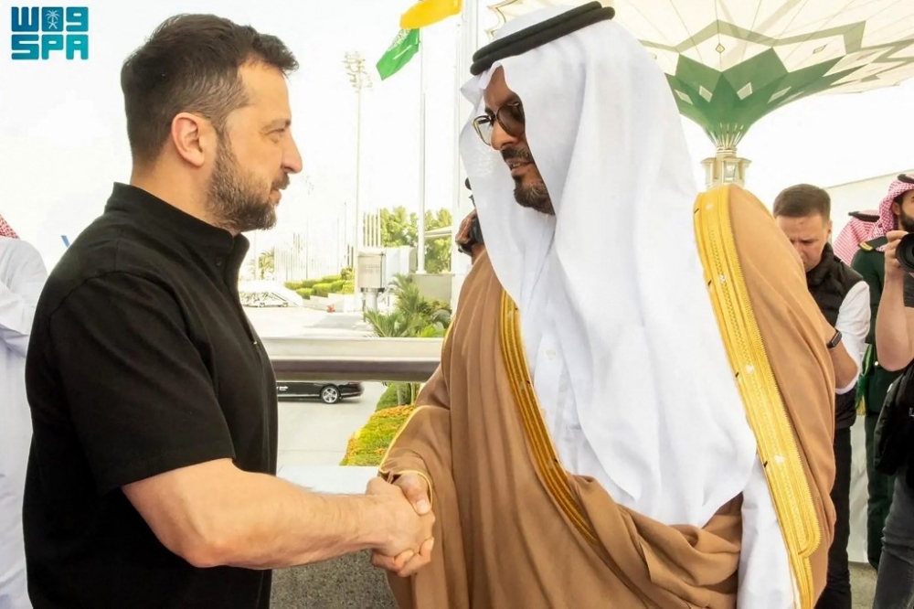 A handout picture provided by the Saudi Press Agency (SPA) on June 12, 2024, shows Ukraine’s President Volodymyr Zelensky (left) being welcomed by deputy Governor of the Mecca region Saud bin Mishaal bin Abdulaziz Al-Saud, upon his arrival at the Jeddah airport. — AFP pic