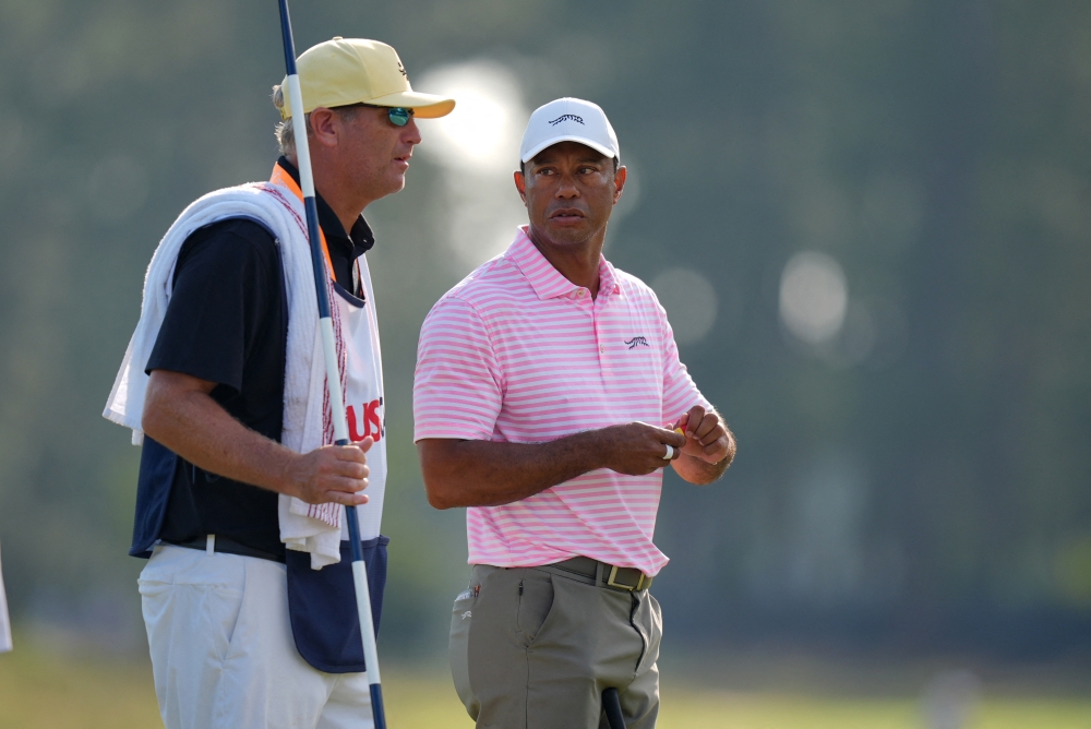 Tiger Woods talks to his caddie on the eleventh green during the first round of the US Open golf tournament in Pinehurst, North Carolina, June 13, 2024. — Jim Dedmon-USA TODAY Sports pic via Reuters 