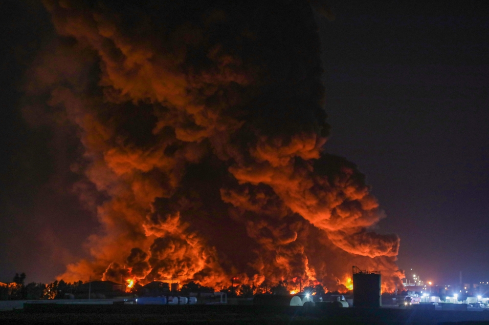 A massive fire at an oil refinery in Iraqi Kurdistan raged for about 20 hours and injured at least 14 firefighters. — AFP pic