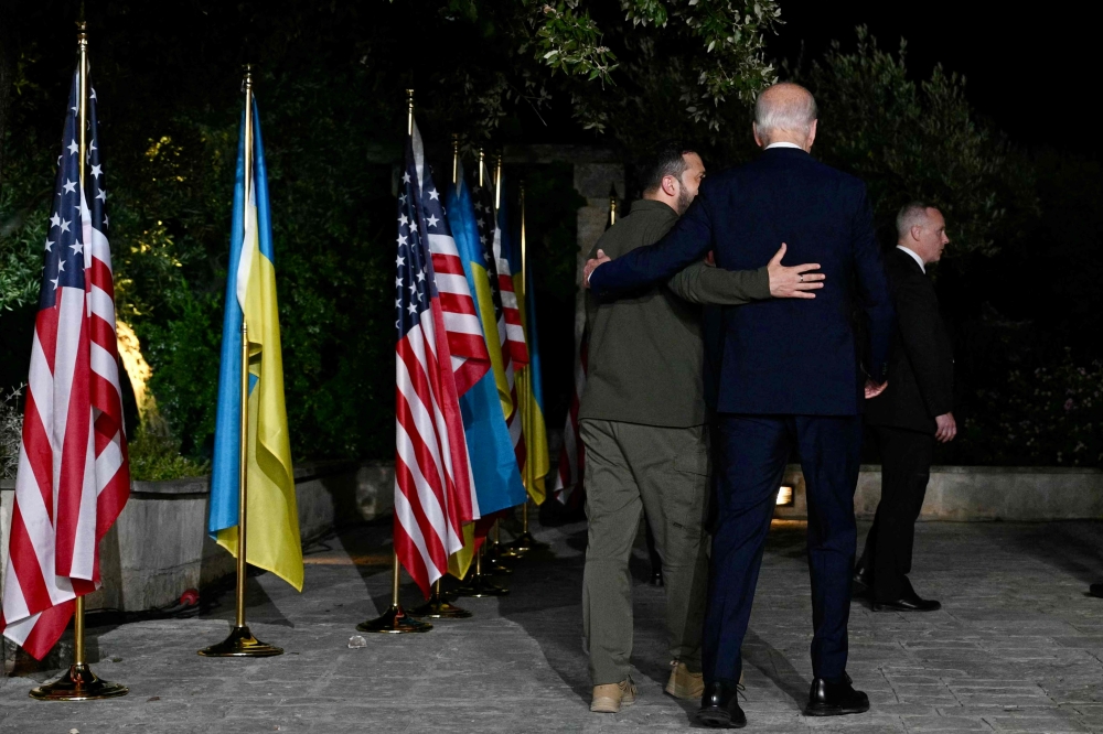 Presidents Joe Biden and Volodymyr Zelensky signed a landmark 10-year security deal between Washington and Kyiv yesterday in what the Ukrainian leader called a historic day in the fight against Russia’s invasion. — AFP pic