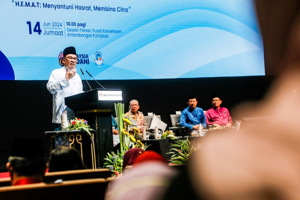 Prime Minister Datuk Seri Anwar Ibrahim speaks during the ‘Himpunan Aspirasi Madani Rakan Pembimbing Perkhidmatan Awam Bersama Perdana Menteri’ programme in Putrajaya June 14, 2024. — Picture by Hari Anggara