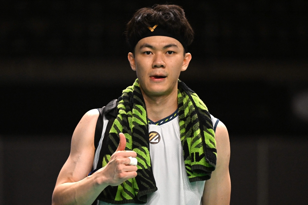 Malaysia’s Lee Zii Jia celebrates winning against Japan’s Kenta Nishimoto after their men’s quarter-final match at the Australia Open badminton tournament in Sydney on June 14, 2024. — AFP pic 
