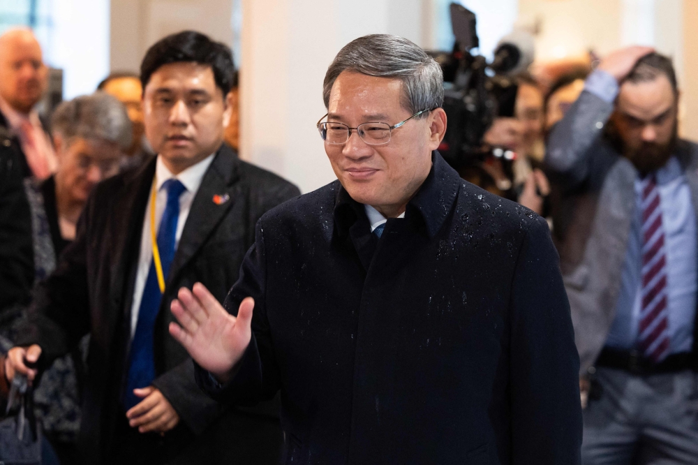 China's Premier Li Qiang waves during a visit to the New Zealand Institute for Plant and Food Research at Mt Albert in Auckland June 14, 2024. — AFP pic