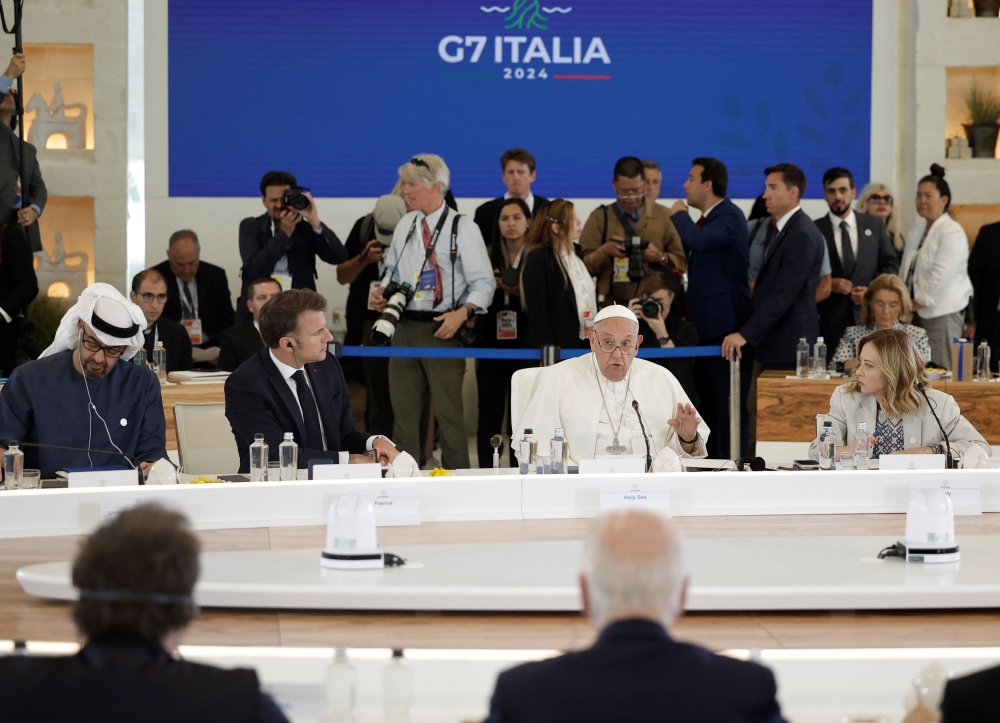 Pope Francis, United Arab Emirates' President Mohammed bin Zayed, Italy's Prime Minister Giorgia Meloni and French President Emmanuel Macron attend a session on Artificial Intelligence (AI), Energy, Africa and Mediterranean on the second day of the G7 summit in Borgo Egnazia, Italy, June 14, 2024. — Reuters pic  