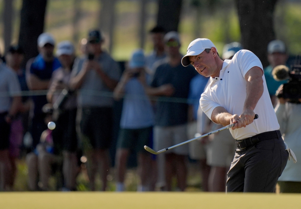 Rory McIlroy chips on the 11th hole during the second round of the US Open golf tournament in Pinehurst, North Carolina, June 14, 2024. — Katie Goodale-USA TODAY Sports pic via Reuters 