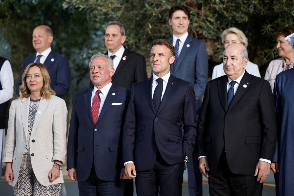 European Commission President Ursula von der Leyen, Italy’s Prime Minister Giorgia Meloni, French President Emmanuel Macron, Canada’s Prime Minister Justin Trudeau, German Chancellor Olaf Scholz, Jordan’s King Abdullah, Algeria’s President Abdelmadjid Tebboune, and Managing director of the International Monetary Fund (IMF) Kristalina Georgieva pose for a family photo on the second day of the G7 summit at the Borgo Egnazia resort, in Savelletri, Italy June 14, 2024. — Reuters pic
