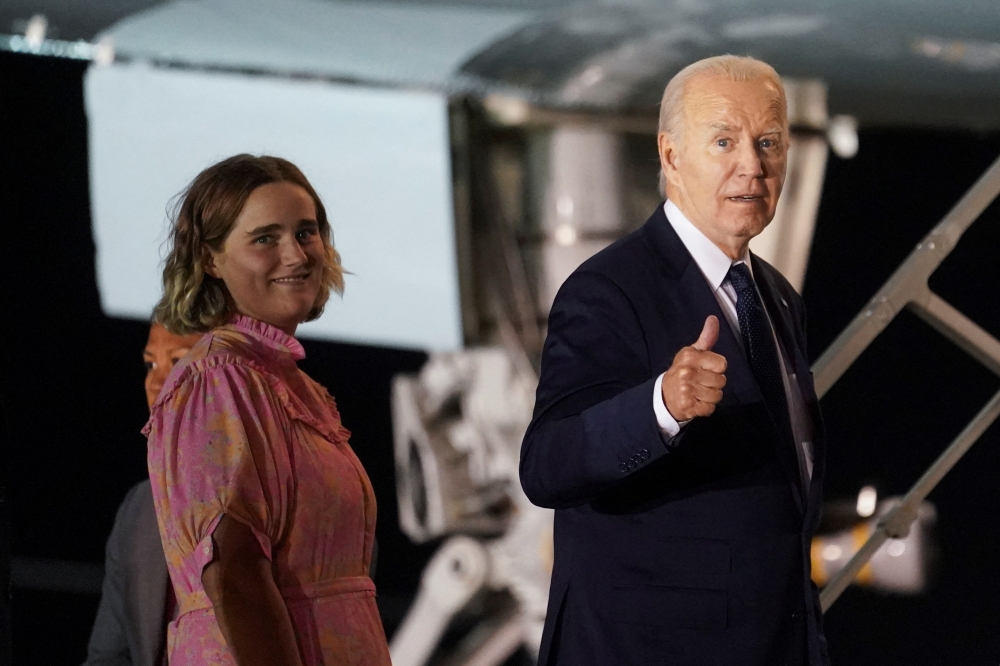 File photo of US President Joe Biden gesturing as he board Air Force One with his granddaughter Maisy, at Brindisi Airport, on the second day of the G7 summit in Puglia, in Brindisi, Italy, June 14, 2024. — Reuters pic