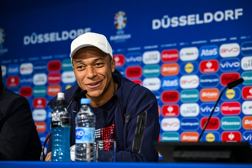 This handout photo taken and released by UEFA on June 16, 2024, shows France's forward Kylian Mbappe giving an MD-1 perss conference Duesseldorf Arena in Duesseldorf, on the eve of their Uefa Euro 2024 Group D football match against Austria. — Picture by Frederic Scheidemann/Uefa via AFP