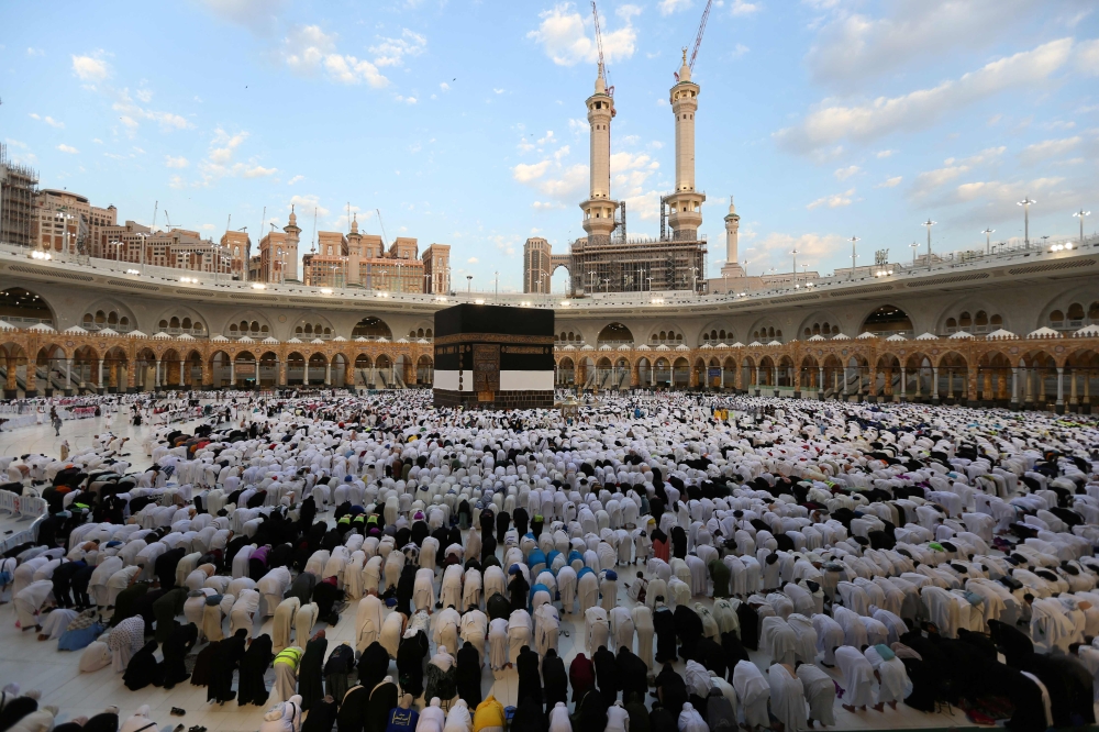 Muslims perform the Eid al-Adha morning prayer around the Kaaba, Islam's holiest shrine, at the Grand Mosque in Saudi Arabia's holy city of Mecca, on the first day of the holiday marking the end of the hajj pilgrimage June 16, 2024. — AFP pic