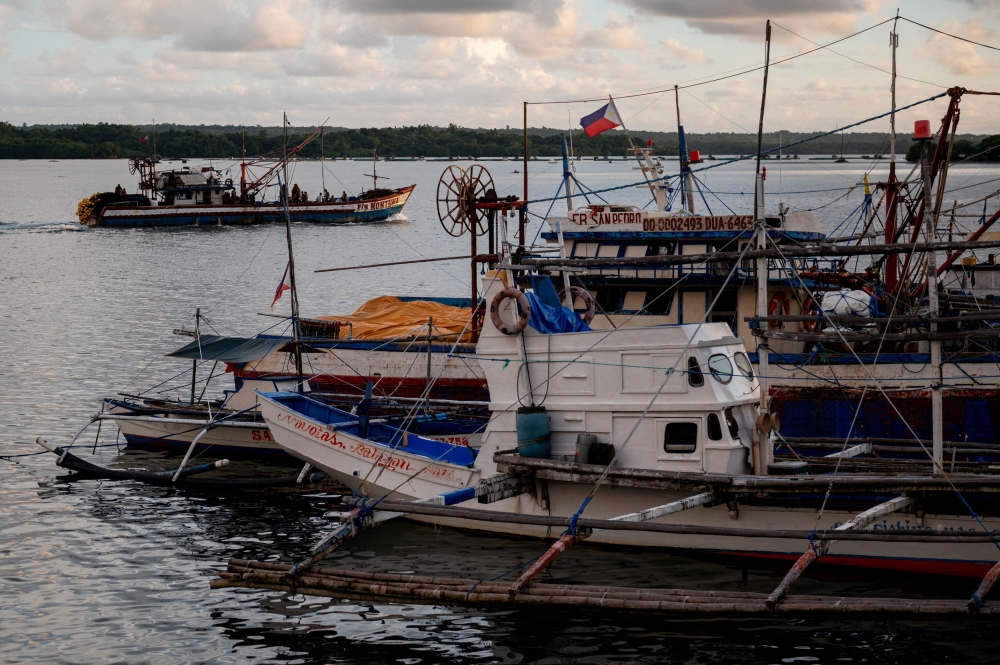 A fishing boat departs from a port in Masinloc, Zambales province, Philippines, September 26, 2023. — Reuters pic