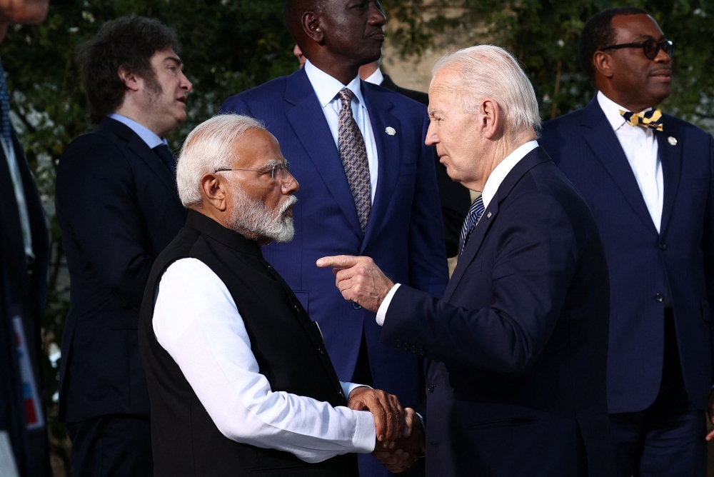 US President Joe Biden speaks with India’s Prime Minister Narendra Modi, as G7 leaders and representatives of States and International Organisations gather for a family photo on the second day of the G7 summit at the Borgo Egnazia resort, in Savelletri, Italy June 14, 2024. — Reuters pic