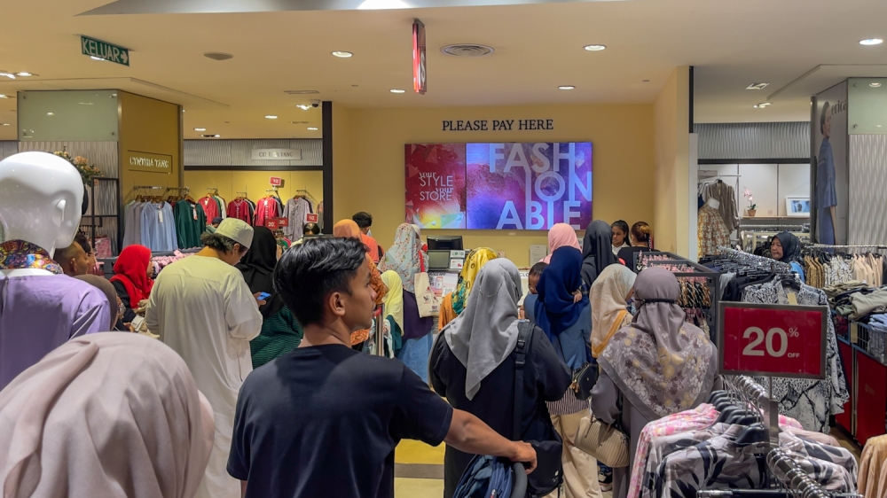 Thirty eight per cent of the AKPK survey respondents said they got into debt because of spending on goods or services they don't actually need, with close to a third within this category admitting they typically buy on impulse. — Picture by Raymond Manuel