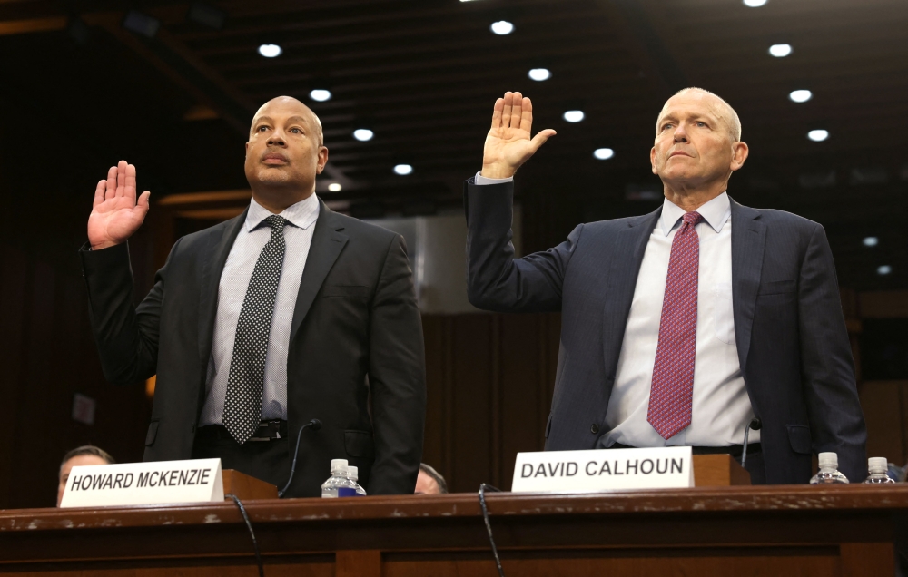 Boeing President and CEO Dave Calhoun and Boeing Chief Engineer Howard McKenzie are sworn in during a Senate Homeland Security and Governmental Affairs Committee Investigations Subcommittee hearing to examine 