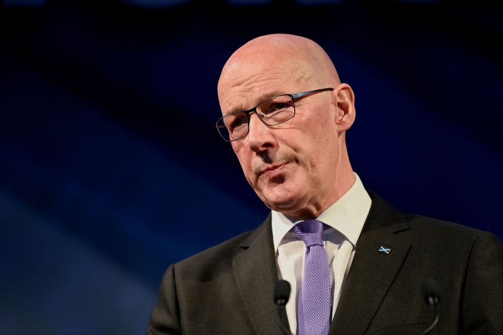 Leader of the Scottish National Party (SNP) John Swinneywould not be drawn on what happens to the independence movement if the SNP loses its majority, as many polls are predicting. — Reuters pic