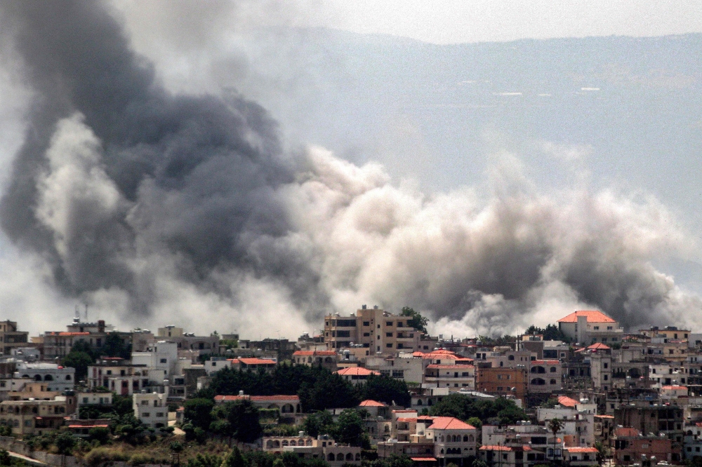 An Israeli bombardment on the village of Khiam in south Lebanon near the border with Israel on June 19, 2024. — AFP pic