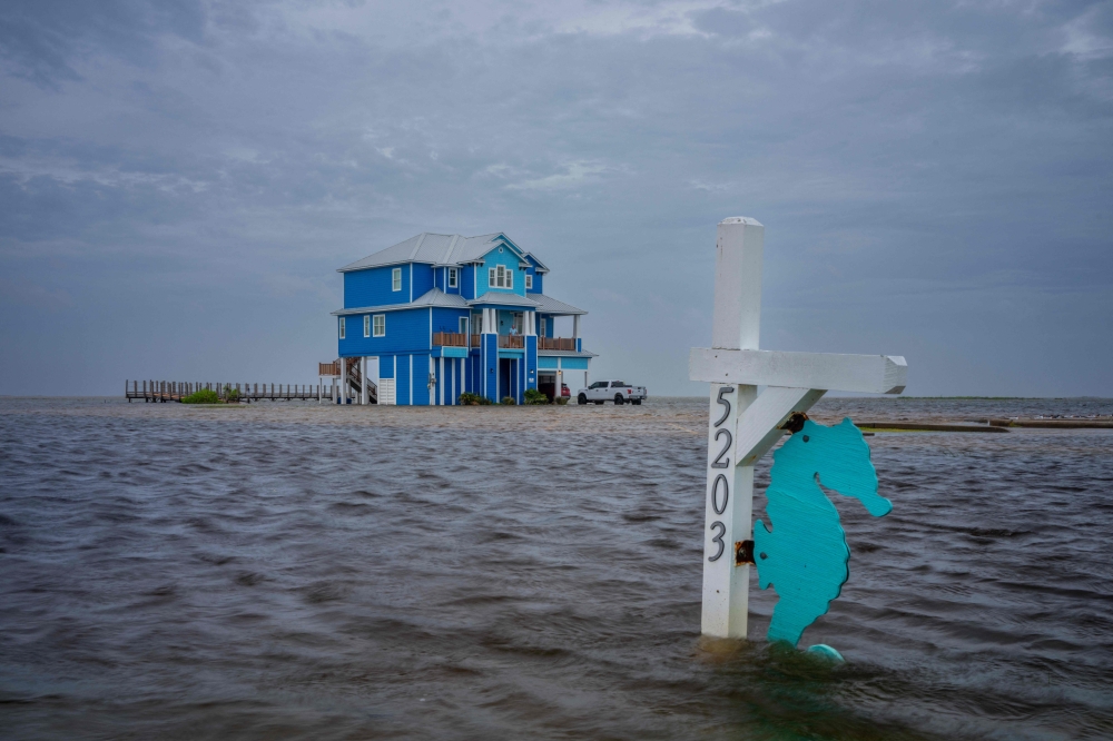 The NHC predicted moderate coastal flooding along much of the Texan coast through Thursday such as this in Surfside Beach, Texas. — AFP pic