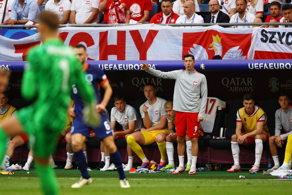 Poland’s Robert Lewandowski reacts from the substitutes bench during the match against Netherlands at Hamburg Volksparkstadion, Hamburg, Germany, June 16, 2024. — Reuters pic 