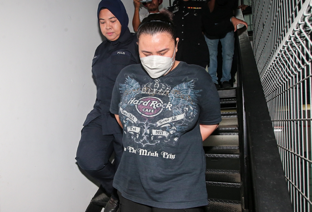 A housewife has been charged with murder of a five-year-old girl at the Magistrate's Court in Ipoh today. — Picture by Farhan Najib