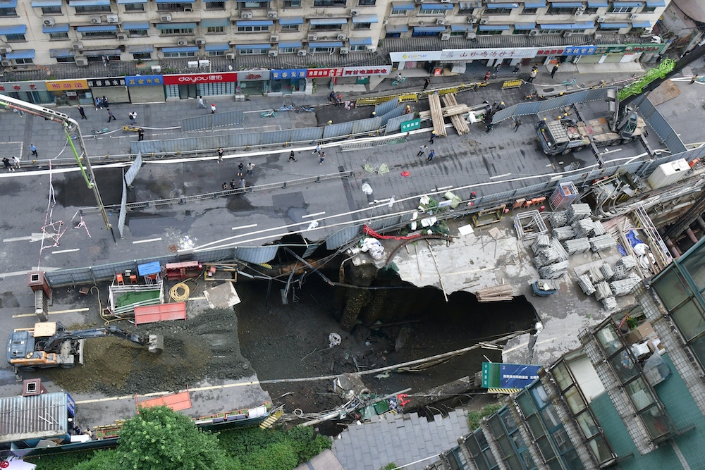 A view of a sinkhole at a road section where a subway construction site collapsed due to burst water pipes, in Chengdu, Sichuan province, China June 21, 2024. — China Daily via Reuters