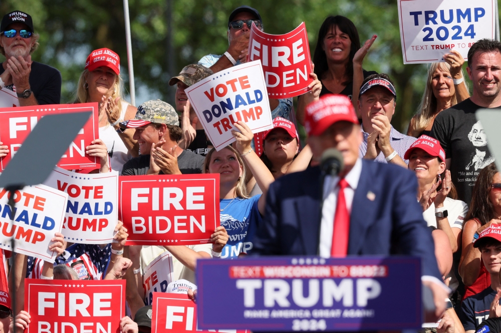 Supporters of former US president and Republican presidential candidate Donald Trump react as he holds a campaign event, in Racine, in Racine, Wisconsin June 18, 2024. ― Reuters pic