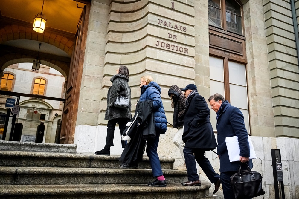 Indian-Swiss billionaire family members Namrata Hinduja (third from right) and Ajay Hinduja (second from right) arrive at the Geneva’s courthouse with their lawyers Yael Hayat (left) and Robert Assael (second from left) at the opening day of their trial for human trafficking on January 15, 2024. — AFP pic
