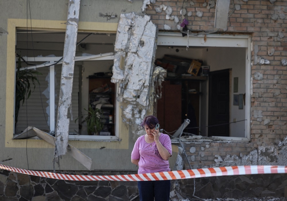 A local woman speaks on her mobile phone at the site of a Russian drone attack, amid Russia's attack on Ukraine, on the outskirts of Lviv, Ukraine June 19, 2024. ― Reuters pic