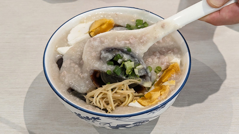 Century egg, salted egg and minced pork porridge at Yee Kee Porridge. — Pictures by Ethan Lau