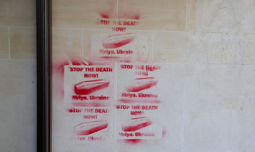 This photograph show graffiti concerning the ongoing conflict following the invasion of Ukraine by Russia, on the facade of the Agence France Presse headquarters in Paris on June 20, 2024. — AFP pic