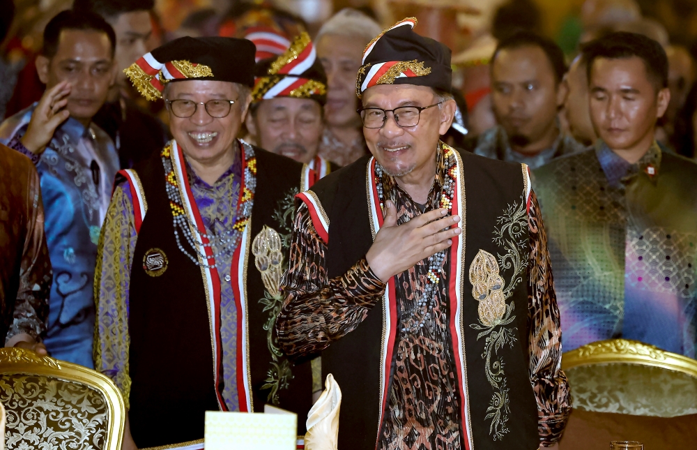 Prime Minister Datuk Seri Anwar Ibrahim attends the Sarawak state-level 2024 Gawai Dayak Dinner at the Borneo Convention Centre Kuching, June 22, 2024. With him is Sarawak Premier Tan Sri Abang Johari Openg. Sarawak has accepted to co-host the 2027 South-east Asian (SEA) Games together with the federal government on condition that the opening ceremony will be held in Kuching while the closing ceremony can be held in Putrajaya. — Bernama pic 