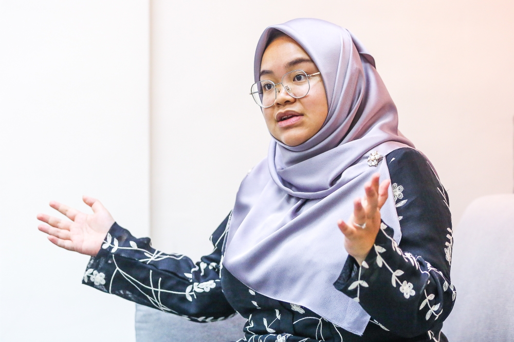  Muda acting president Amira Aisya Abd Aziz speaks to Malay Mail during an interview at its headquarters in Kelana Jaya June 5, 2024. — Picture by Yusof Mat Isa