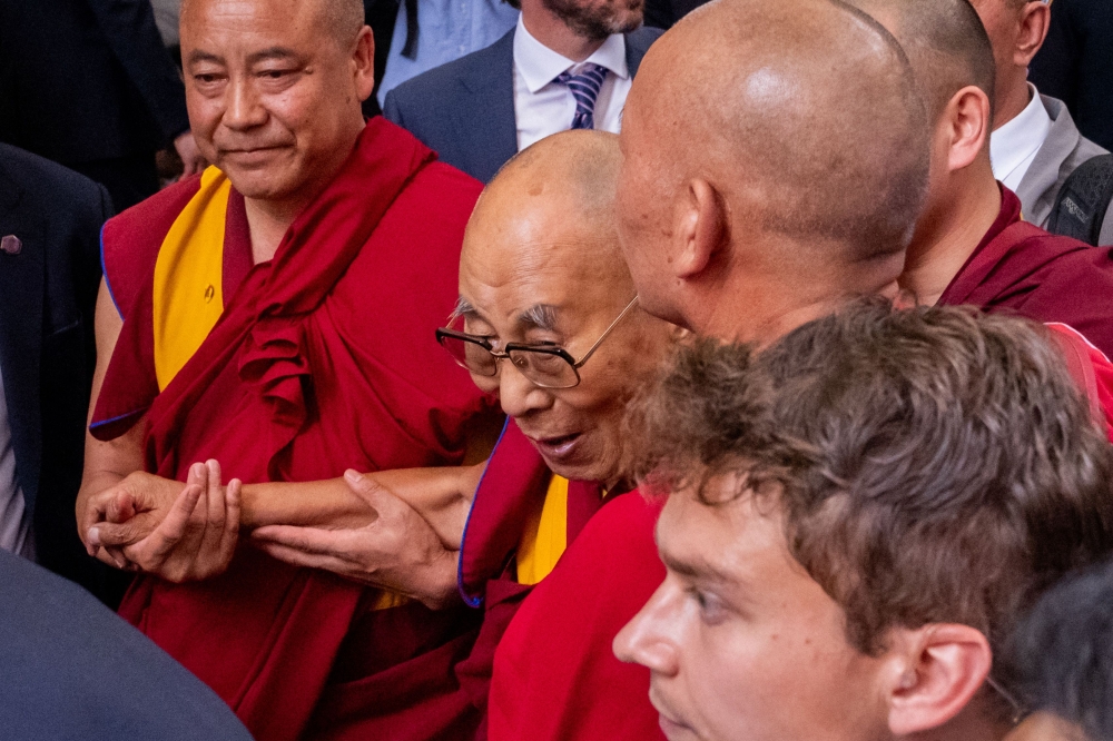 Tibet’s spiritual leader the Dalai Lama arrived yesterday in New York to undergo knee treatment, drawing a warm and festive welcome from thousands of followers. — AFP pic