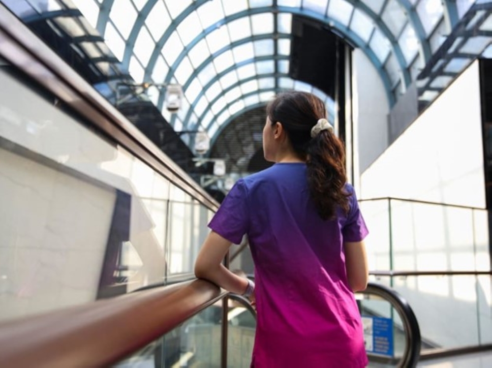 A junior doctor who broke her bond with MOH Holdings. — TODAY pic