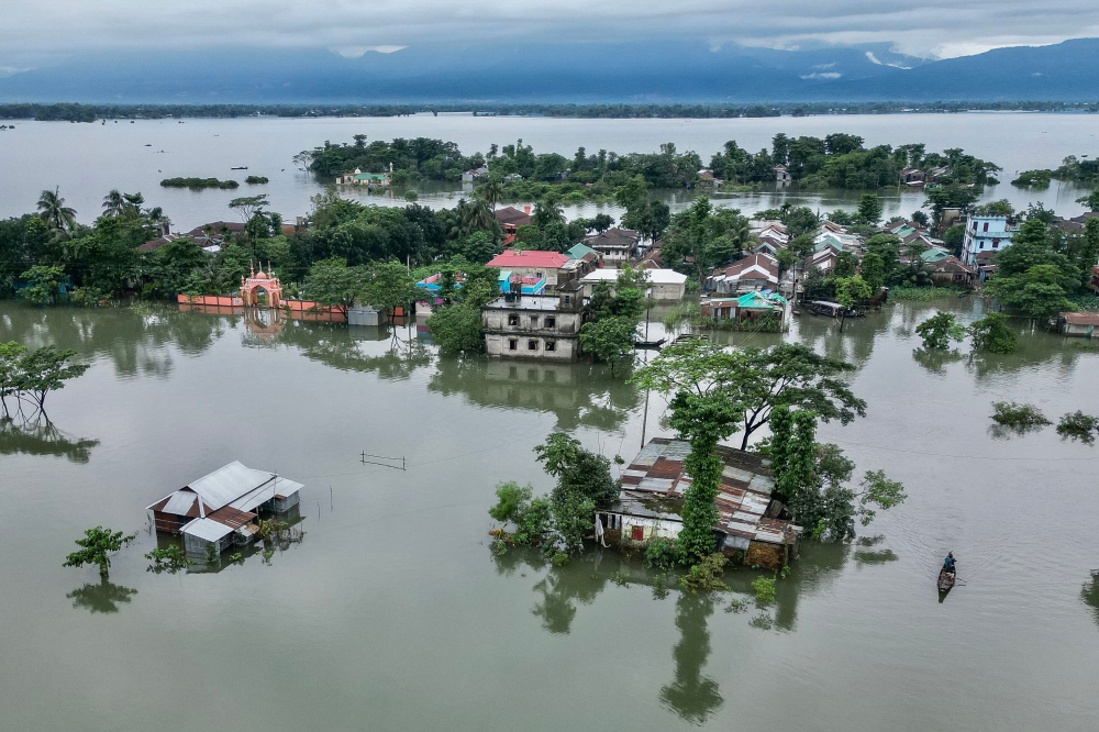 In Sylhet on June 20, 2024, lashing rain and rivers swollen by flooding upstream in India also swamped heavily populated areas. — AFP pic