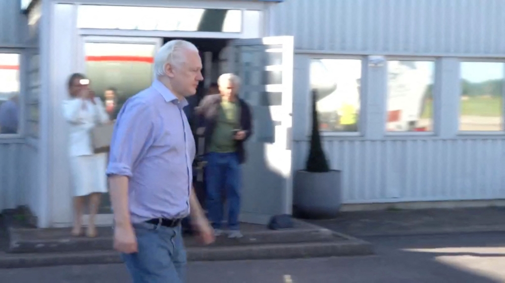 WikiLeaks founder Julian Assange walks to board a plane at a location given as London, Britain, in this still image from video released JUNE 25, 2024. — Handout by Wikileaks via Reuters