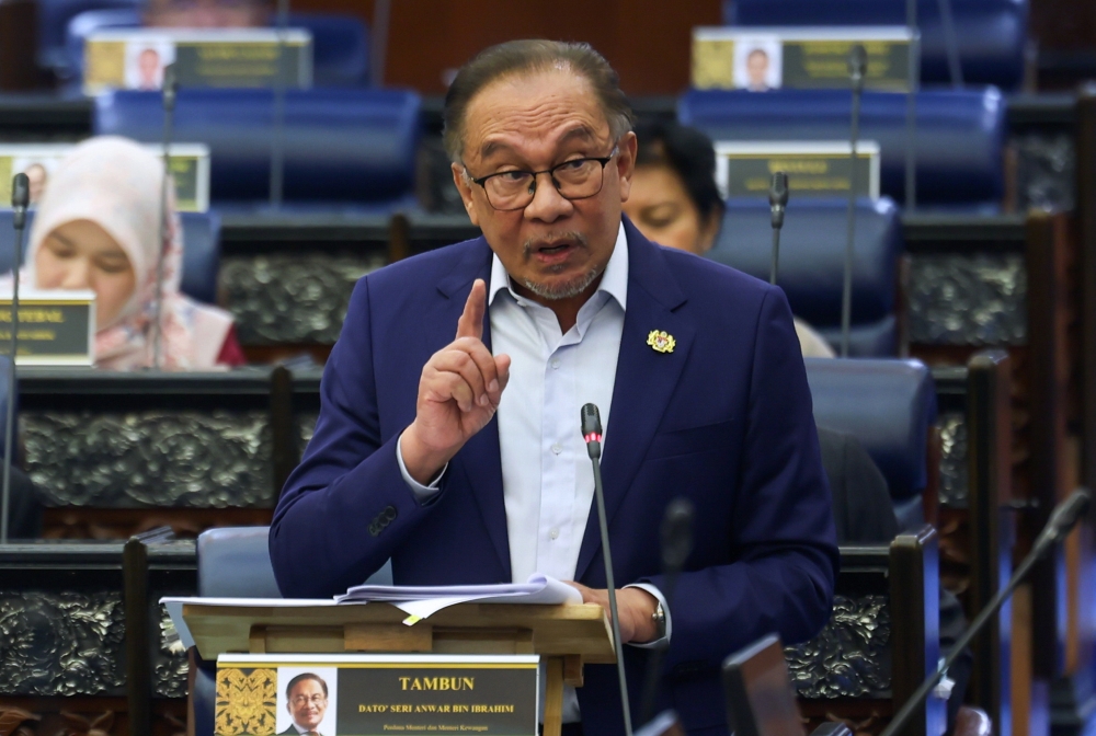 Prime Minister Datuk Seri Anwar Ibrahim speaks at the Parliament in Kuala Lumpur June 25, 2024. — Bernama pic
