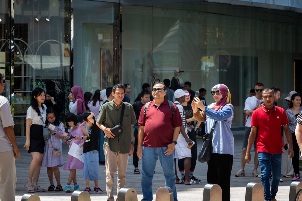 File picture of people at Bukit Bintang, Kuala Lumpur, April 11, 2024. Gallup’s Positive and Negative Experience Indexes measure life’s intangibles, feelings and emotions, which indicate how pervasive positive and negative emotions are in each country, whereby the findings in the report are based on nearly 146,000 interviews with adults in 142 countries and areas in 2023. — Picture by Raymond Manuel