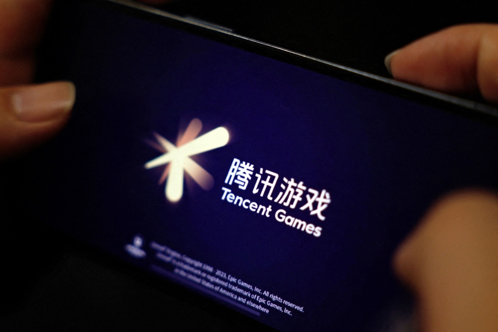 The Tencent Games logo is seen on its game on a mobile phone in this illustration picture taken March 19, 2024. — Reuters file pic