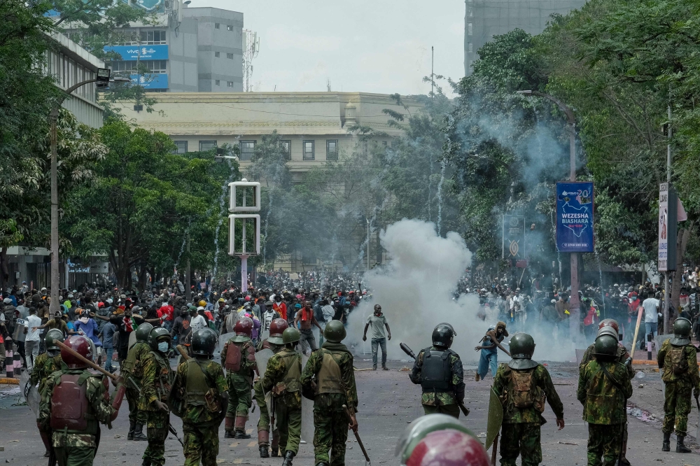 Kenya was in a state of shock today following unprecedented scenes that left parts of parliament ablaze and gutted, as protests over proposed tax hikes turned deadly, prompting President William Ruto’s government to deploy the military. — AFP pic
