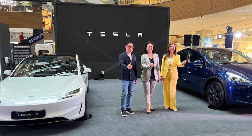 (from left) Peter Chan, General Manager of East Coast Mall, Gurney Plaza & Queensbay Mall, Isabel Fan, Tesla's Regional Director and Selina Ng, Head of Retail, CapitaLand Investment (Malaysia) at the launch of the Tesla showcase at Gurney Plaza. — Picture courtesy of CapitaLand